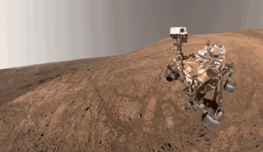 The Perseverance rover on a brownish hill.