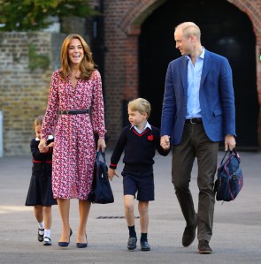 LONDON, UNITED KINGDOM - SEPTEMBER 5: Princess Charlotte, hide behind her mother the Duchess of Cambridge as she arrives for her first day at school, with her brother Prince George and her father the Duke of Cambridge
at Thomas's Battersea in London on September 5, 2019 in London, England. (Photo by Aaron Chown - WPA Pool/Getty Images)