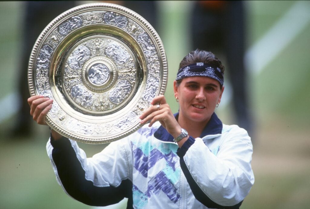 Conchita Martinez celebrates with the Wimbledon trophy after beating Martina Navratilova in the 1994 final