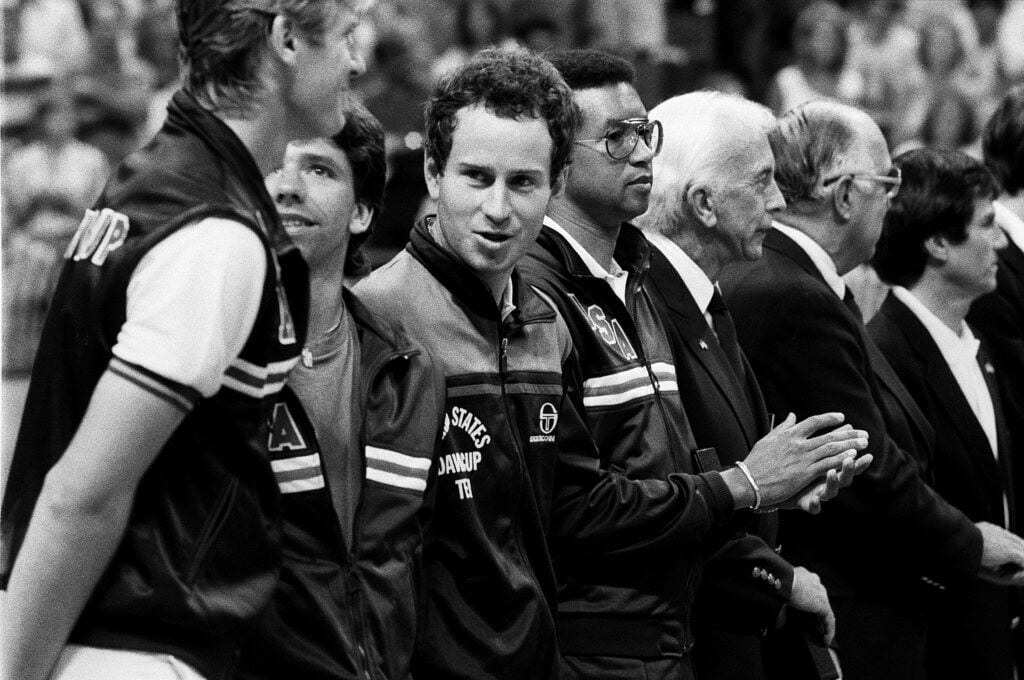 John McEnroe and Arthur Ashe at the 1984 Davis Cup