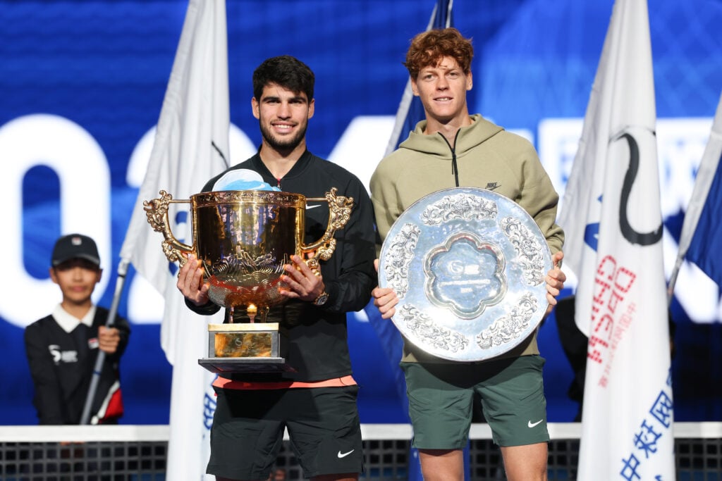 Carlos Alcaraz and Jannik Sinner pose with their trophies after the 2024 China Open final