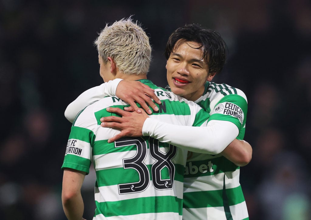 Reo Hatate hugs his Celtic teammate Daizen Maeda