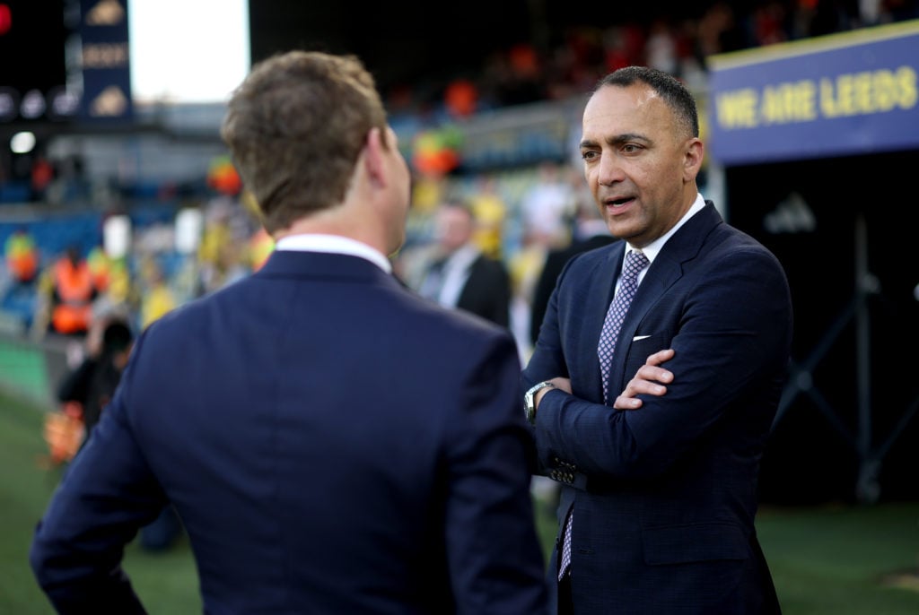 Leeds United and 49ers Enterprises chairman Paraag Marathe speaks with a colleague