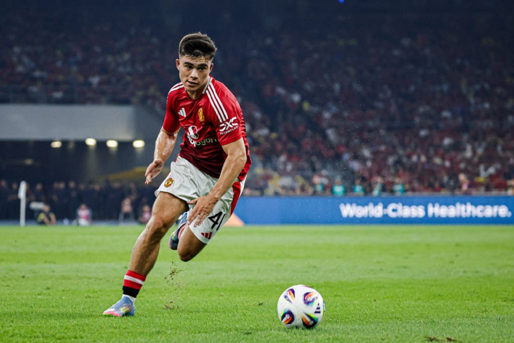 Harry Amass chasing the ball for Manchester United.