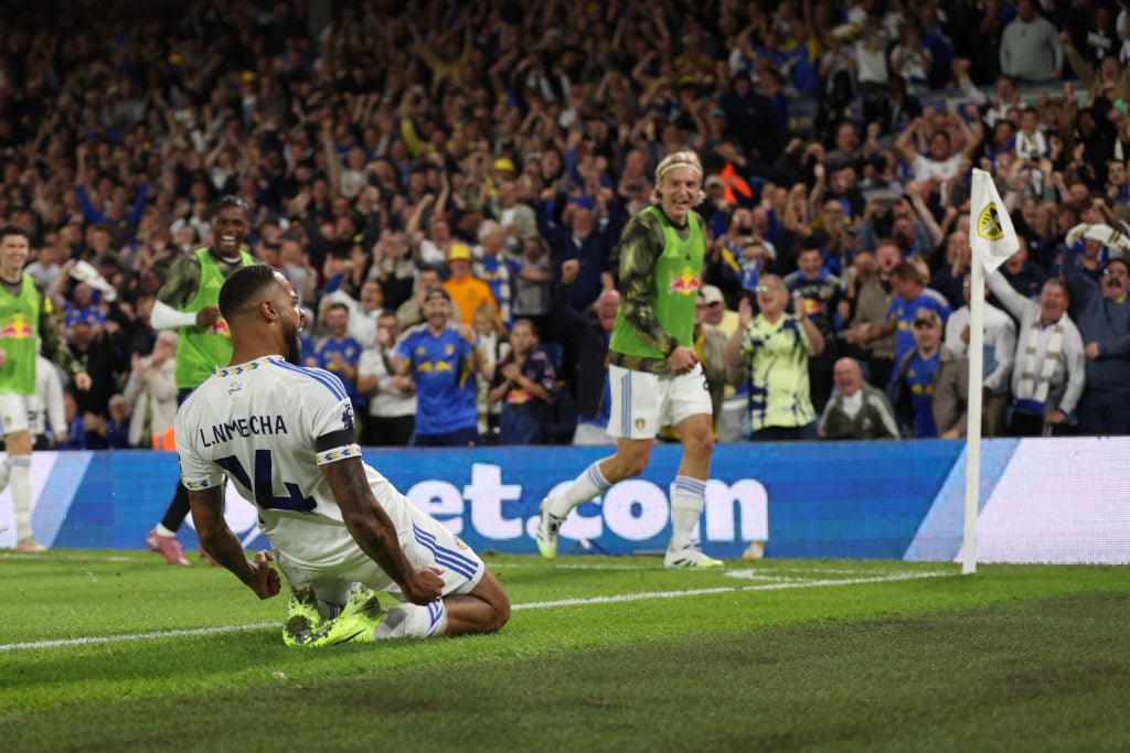 Lukas Nmecha skids in celebration after scoring for Leeds vs Everton.