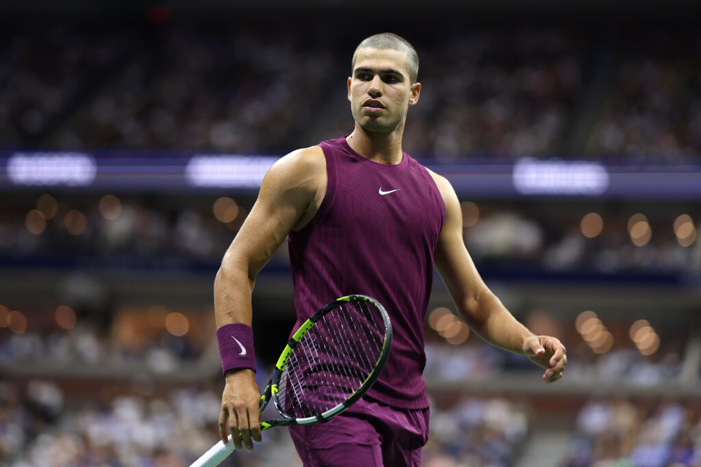 Carlos Alcaraz of Spain reacts against Reilly Opelka of the United States during their Men's Singles First Round match on Day Two of the 2025 US Open at USTA Billie Jean King National Tennis Center on August 25, 2025 in the Flushing neighborhood of the Queens borough of New York City.