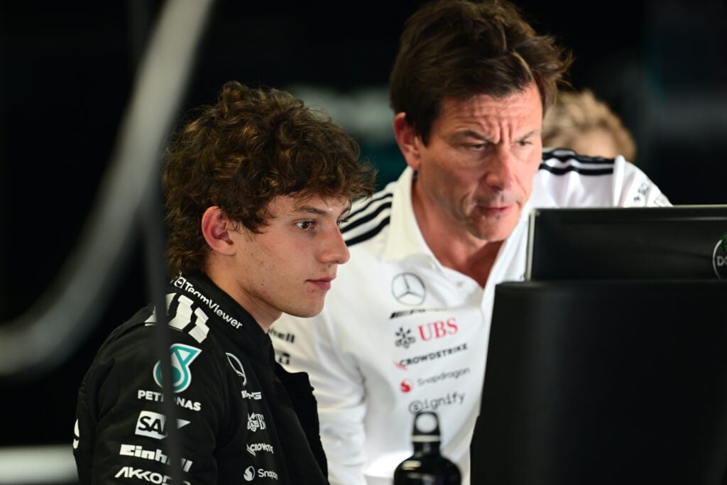 Mercedes team principal Toto Wolff (right) and driver Andrea Kimi Antonelli (left) studying a monitor ahead of qualifying for the 2025 Formula 1 Italian Grand Prix