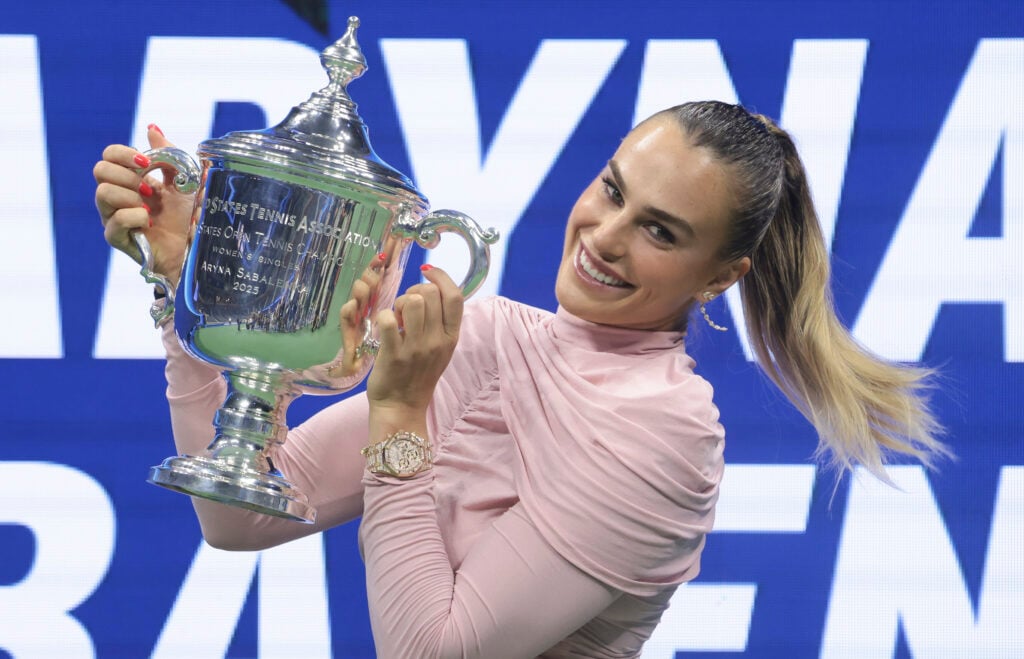Aryna Sabalenka posing with the 2025 US Open women's singles title.