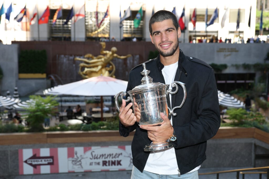 US Open 2025 Champion Carlos Alcaraz of Spain poses for a photo overlooking Rockefeller Plaza with the Men's Singles trophy following his victory over Jannik Sinner of Italy in the Men's Singles Final.