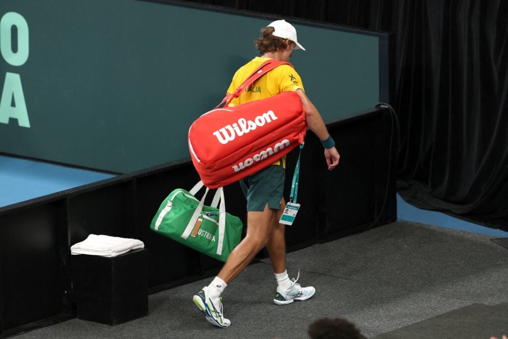 Alex de Minaur walks off court after losing at the 2025 Davis Cup
