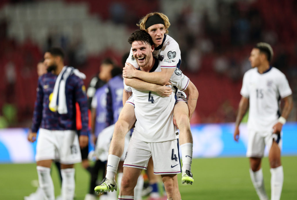 Anthony Gordon and Declan Rice celebrate together after England's win over Serbia.
