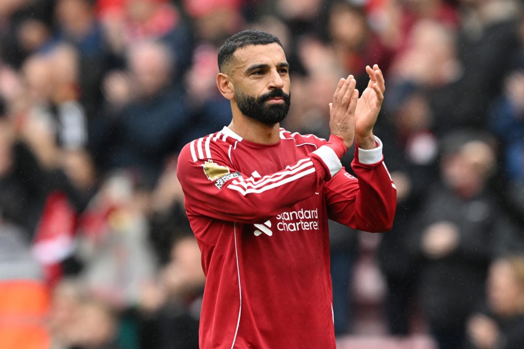 Mohamed Salah of Liverpool celebrates following the team's victory in the Premier League match between Liverpool and Everton at Anfield.