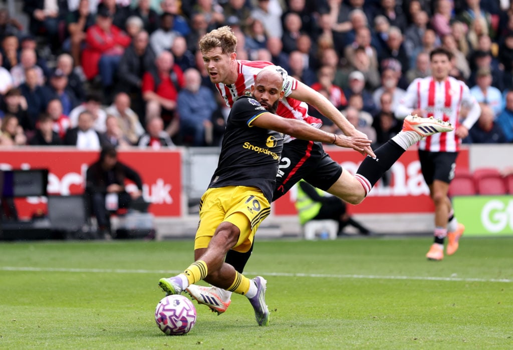 Nathan Collins tugging Bryan Mbeumo from behind