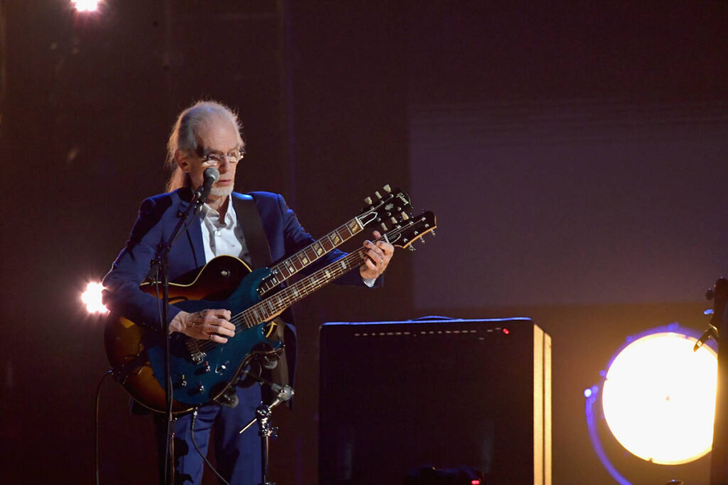Steve Howe playing a guitar with two fretboards at the Rock & Roll Hall of Fame induction in 2017