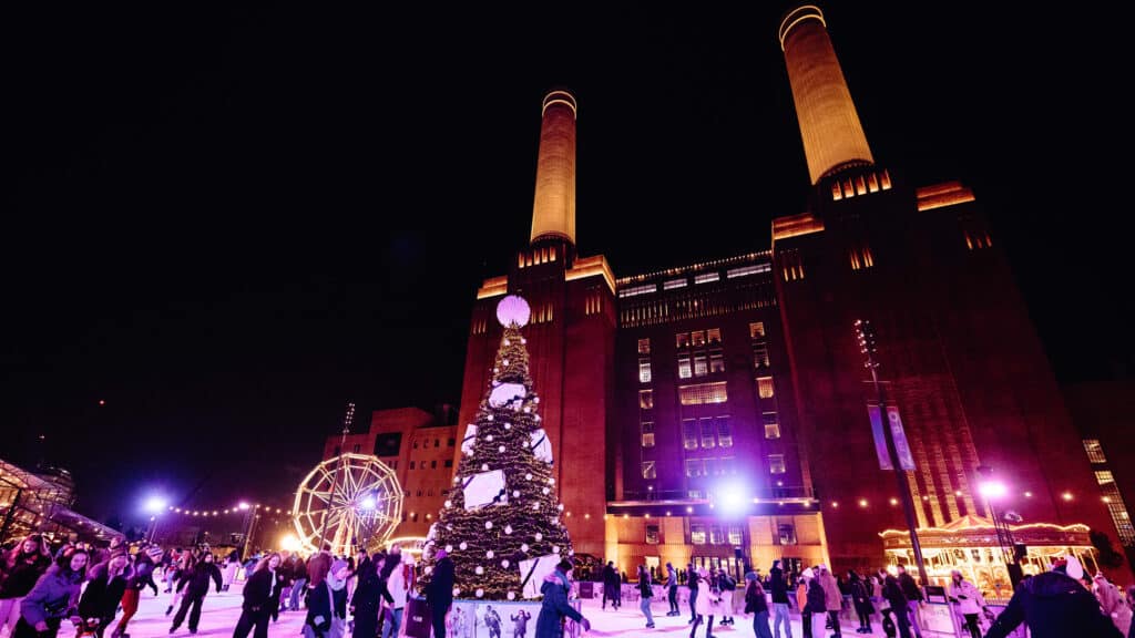 Families ice skating at Boots presents Glide at Battersea Power Station.