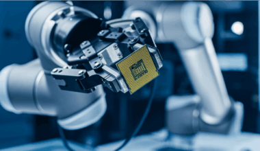 chip being held by robotic arm