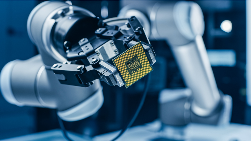 chip being held by robotic arm