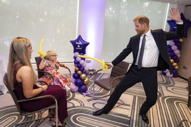 LONDON, ENGLAND - SEPTEMBER 8: Prince Harry, Duke of Sussex speaks with 13-year-old Ansel Hayward (left), recipient of the Inspirational Young Person 12-14 award, at the annual WellChild Awards 2025, which celebrates the achievements and resilience of seriously ill youngsters and their families, at the Royal Lancaster Hotel on September 8, 2025 in London, England. (Photo by Aaron Chown - Pool/Getty Images)