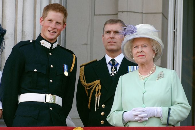 Prince Harry, Prince Andrew, Duke of York, and HM Queen Elizabeth II, The Queen, watch the flypast over The Mall of British and US World War II aircraft from the Buckingham Palace balcony on National Commemoration 