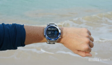 A Huawei Watch Ultimate displays a user's watch face.