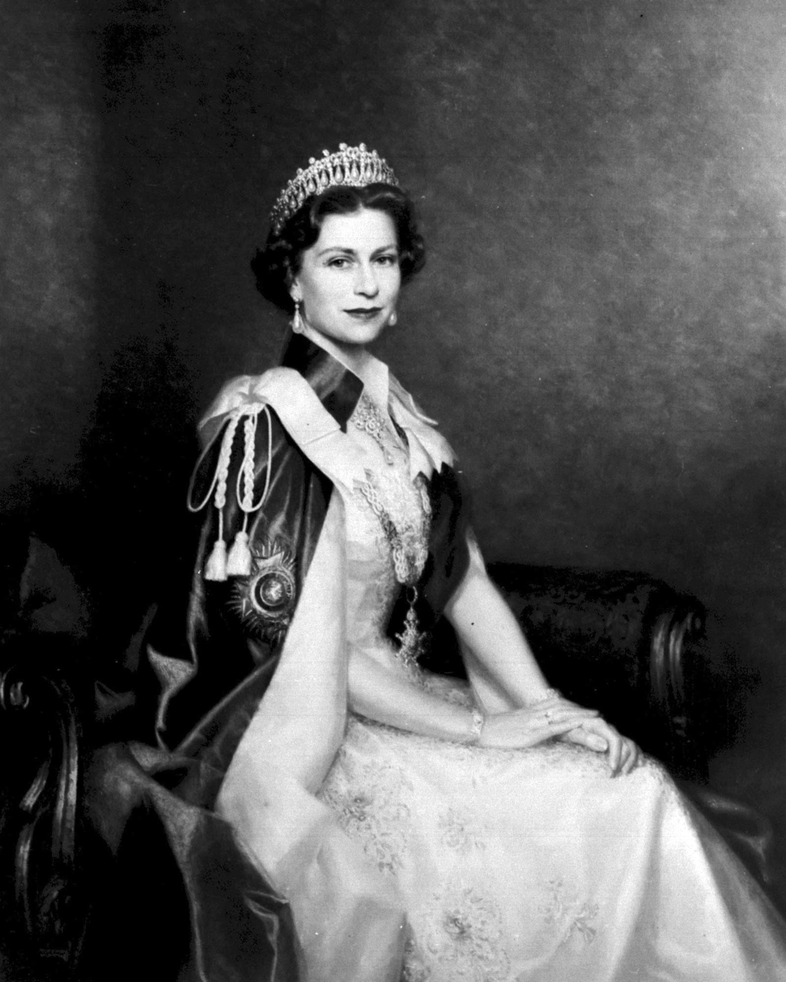 Kate Middleton’s Jewels: How The Princess of Wales Carries on a Royal Jewelry Legacy 14 A portrait of Queen Elizabeth II painted for the Royal Military Academy, Sandhurst, by Leonard Boden.