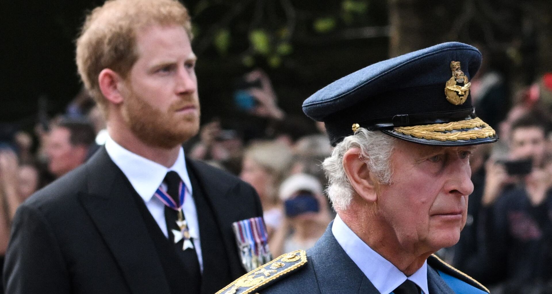 Britain's King Charles III and Britain's Prince Harry, Duke of Sussex walk behind the coffin of Queen Elizabeth II,