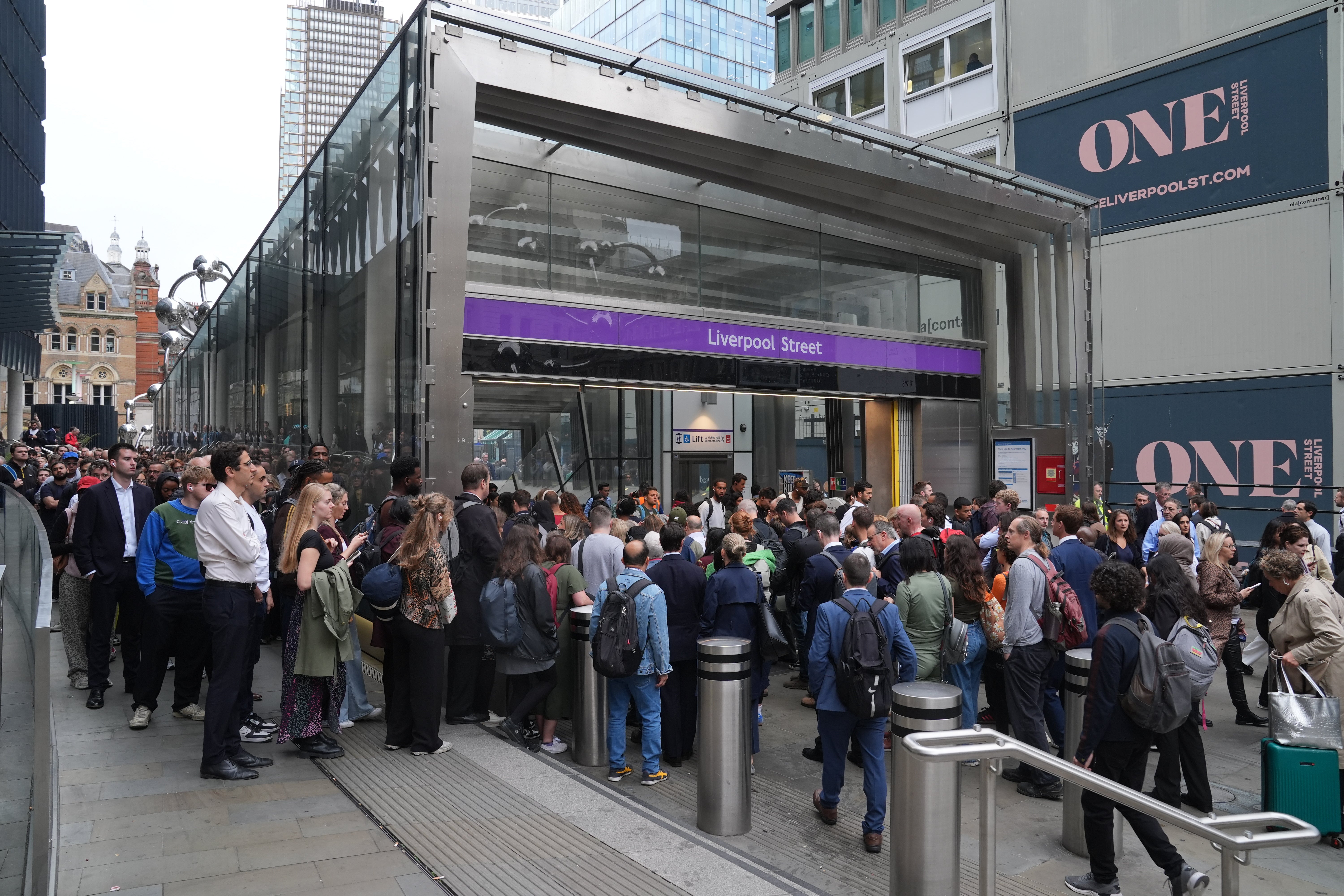 Passengers queue up outside Liverpool Street Station during the strike of RMT members this week