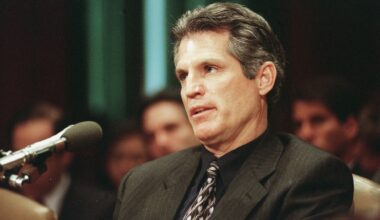 Paul Gelsinger speaks into a microphone