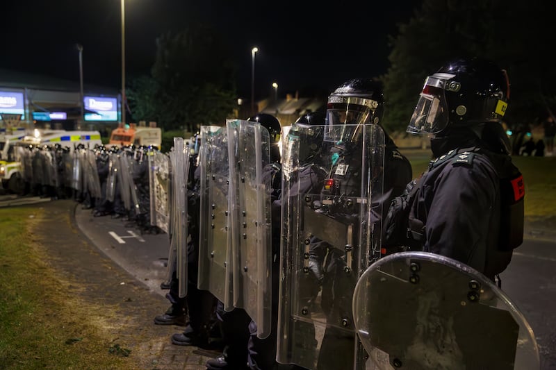 PSNI officers form a barricade with riot shields in Ballymena on Thursday