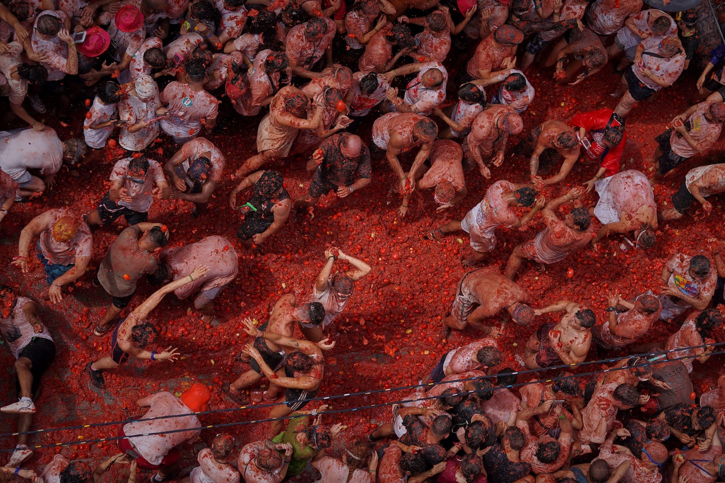 Revelers threw tomatoes at each other during the annual "Tomatina" tomato fight fiesta, in the village of Bunol near Valencia, Spain, on Wednesday.
