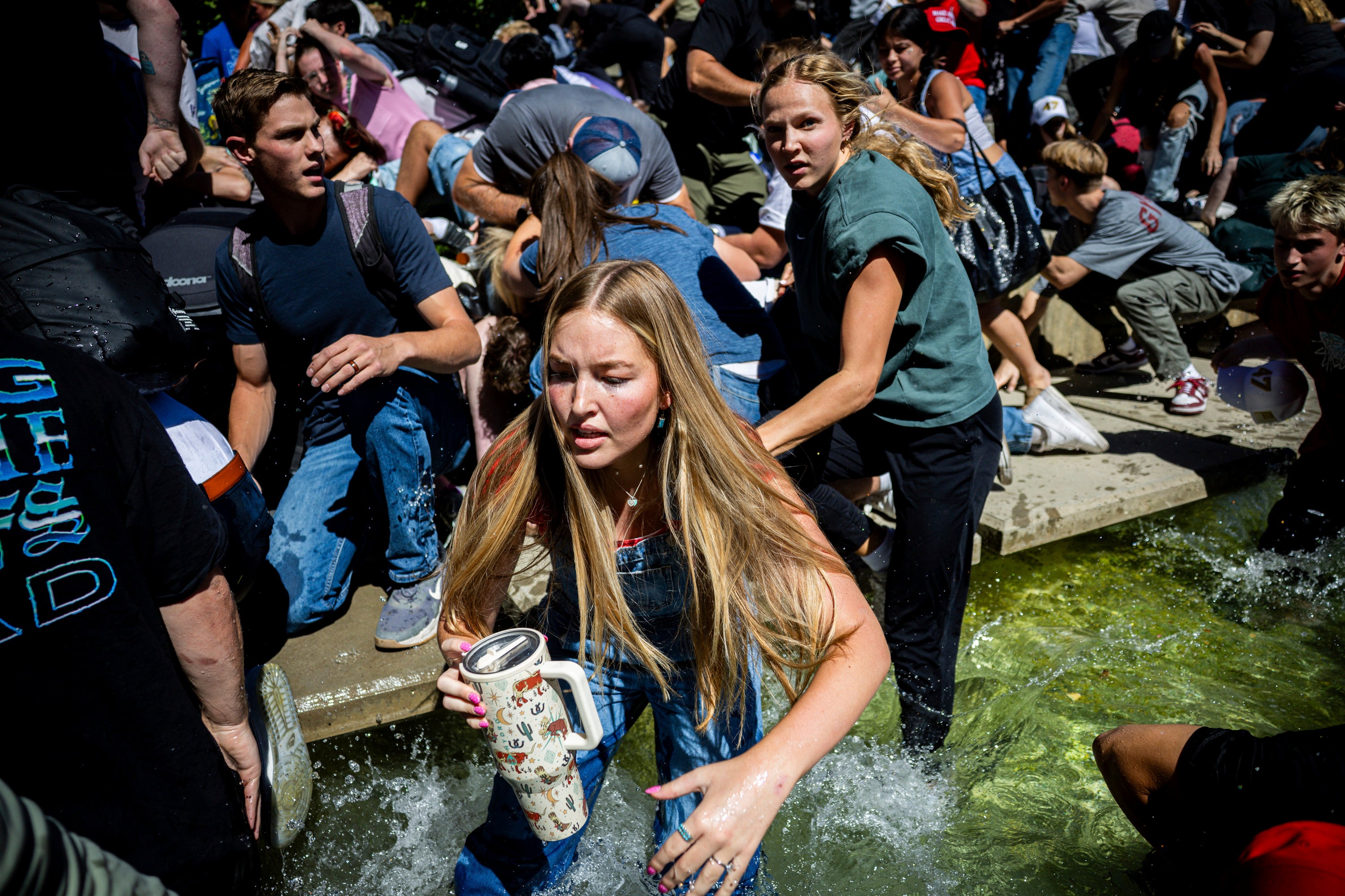 Students panic after the shots rang out on campus at Utah Valley University on September 10