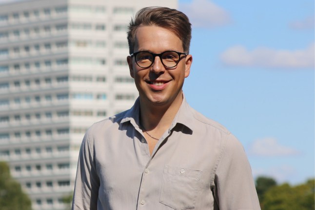 EastEnders executive producer Ben Wadey stood in front of a towerblock