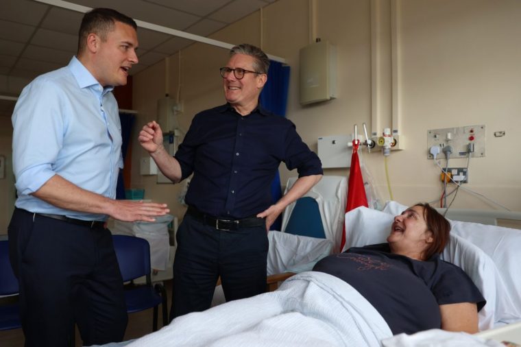WORKSOP, ENGLAND - JUNE 15: Leader of the Labour Party Keir Starmer (C) and Shadow Secretary of State for Health Wes Streeting (L) meet a patient as they visit Bassetlaw Hospital Nottinghamshire to launch Labour's Plans to clear the NHS backlog on June 15, 2024 in Worksop, England. Data published this week showed NHS waiting lists are at 7.6 million people. Labour plans to clear the backlog with 40,000 extra appointments to be offered each week in the evenings and at weekends. (Photo by Cameron Smith/Getty Images)