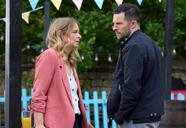 Ross confronts Charity outside the pub in Emmerdale