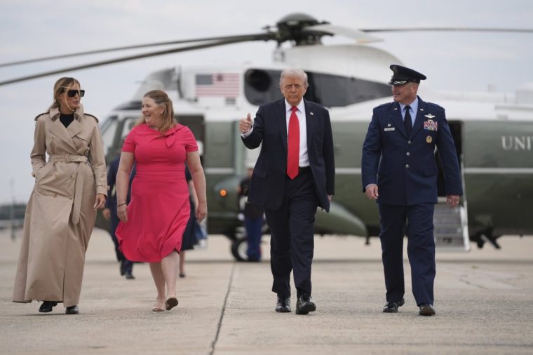 President Donald Trump and first lady Melania Trump are escorted by Air Force Col. Christopher M. Robinson, Commander, 89th Airlift Wing, right, and his wife Stephanie Robinson, as they walk to board Air Force One, Tuesday, Sept. 16, 2025, in Joint Base Andrews, Md. (AP Photo/Evan Vucci)