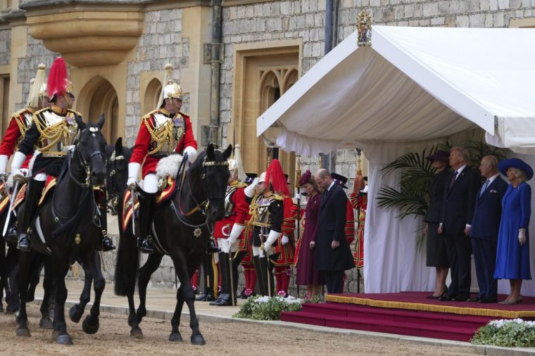 WINDSOR, ENGLAND - SEPTEMBER 17: President Donald Trump, King Charles III, Queen Camilla and Melania Trump review the Guard of Honour at Windsor Castle on day two of the US President Donald Trump's second state visit to the UK on September 17, 2025 in Windsor, England. (Photo by Kirsty Wigglesworth - WPA Pool/Getty Images)