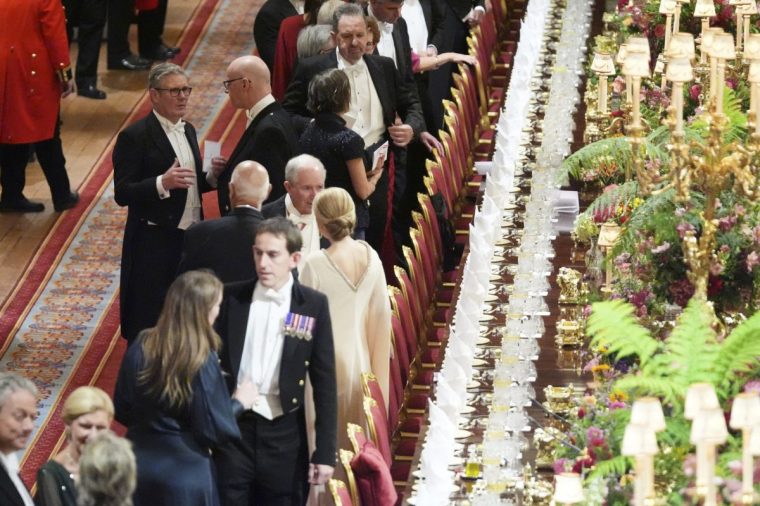 Britain's Prime Minister Keir Starmer, left, attends a State Banquet at Windsor Castle in Windsor, England, Wednesday, Sept. 17, 2025. (AP Photo/Evan Vucci, Pool)