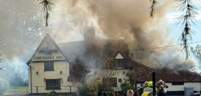 Crossbow-wielding man dies in police standoff at burning pub