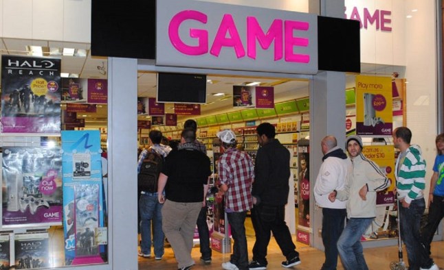 People walking into a Game store for a midnight launch