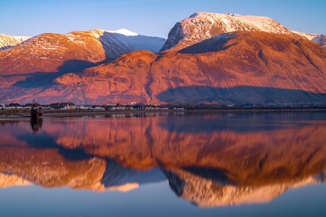 Last light on the famous Ben Nevis mountain with Loch Eilch. Taken from Corpach looking towards Inverlochy and Lochybridge with Fort William just to the right. Scottish Highlands