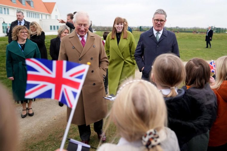 Britain's King Charles III, Britain's Prime Minister Keir Starmer (R) and Deputy Prime Minister Angela Rayner (C) speak to school children during a visit to Nansledan School in Newquay, south west England on Monday February 10, 2025. (Photo by Alastair Grant / POOL / AFP) (Photo by ALASTAIR GRANT/POOL/AFP via Getty Images)