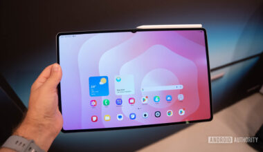 Samsung Galaxy Tab S11 Ultra in man's hand showing home screen