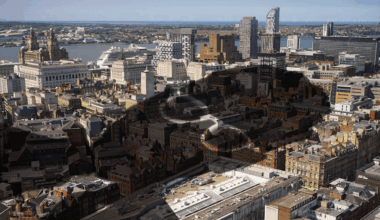 A shadow of Keir Starmer superimposed over an aerial shot of Liverpool