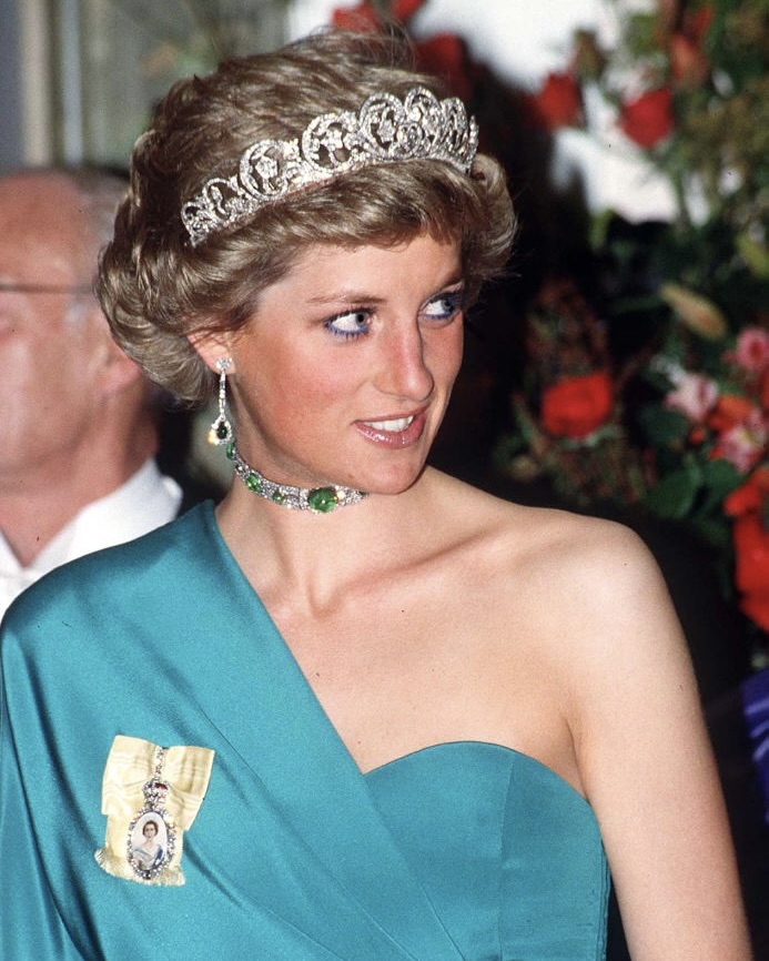 Kate Middleton’s Jewels: How The Princess of Wales Carries on a Royal Jewelry Legacy 22 Princess Diana wearing The Spencer Diamond Tiara, Queen Mary's Cabochon Emerald And Diamond Choker Necklace (a Gift From The Monarch) and The Royal Family Orders. (Getty Images)