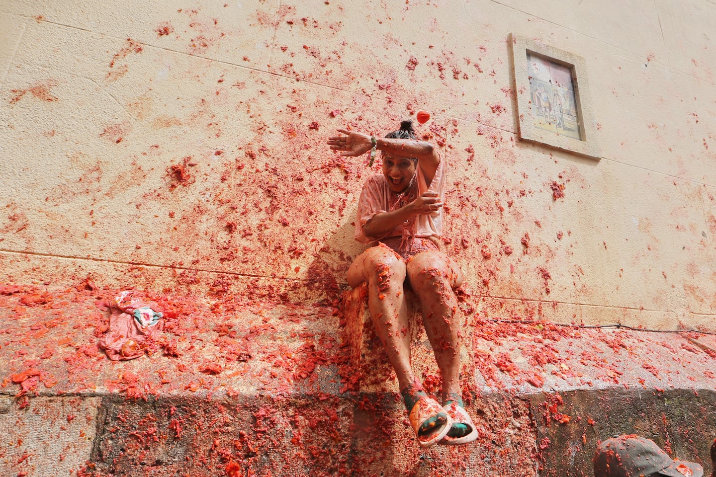 Revelers threw tomatoes at each other during the annual "Tomatina" tomato fight fiesta.