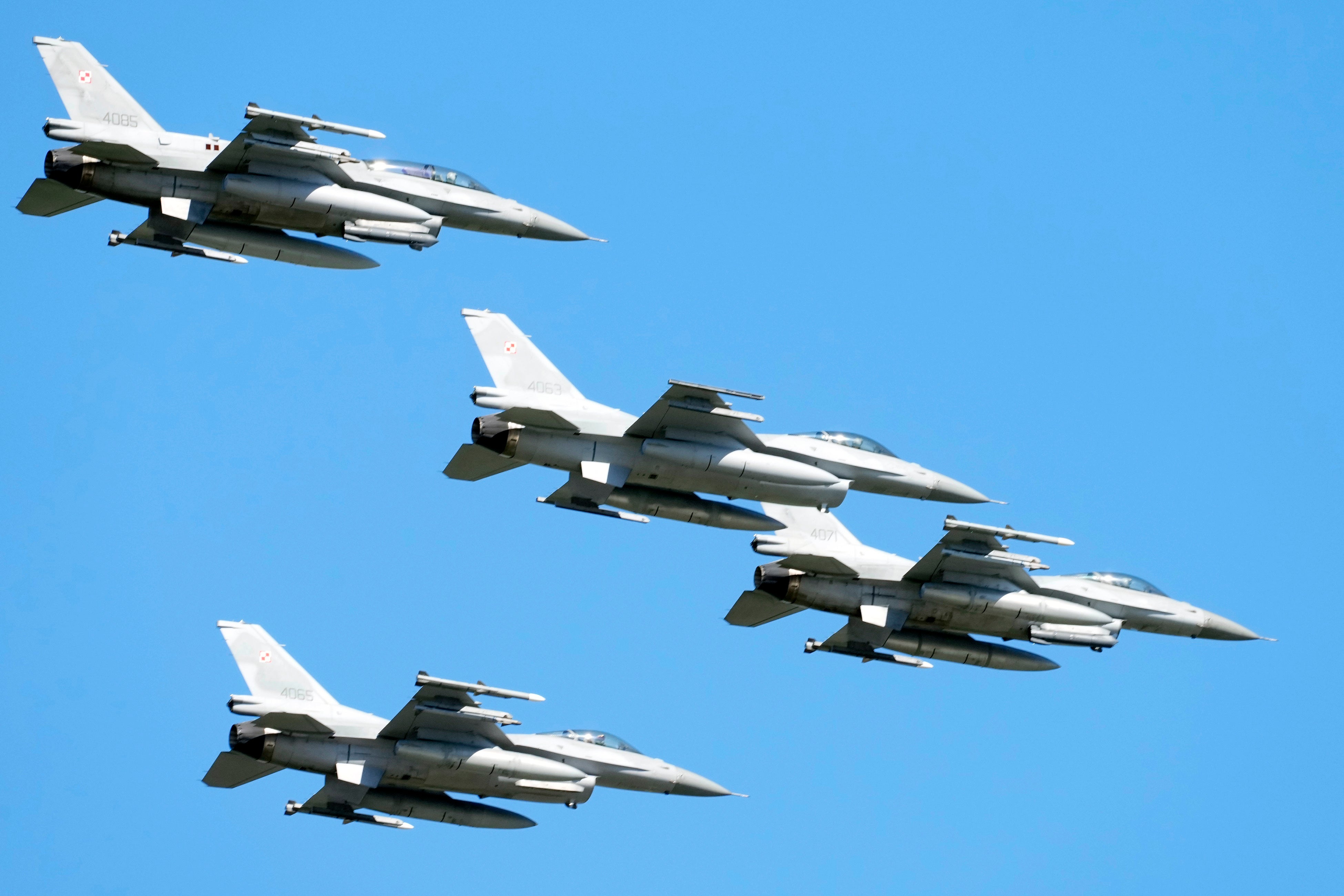 File: F-16 fighter jets fly in the sky over Poland's capital Warsaw