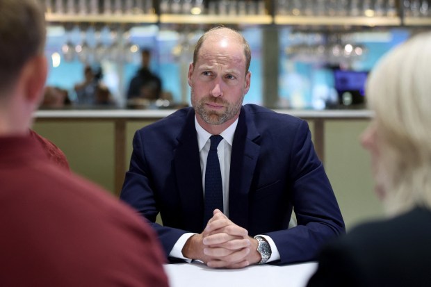 Britain's Prince William, Prince of Wales reacts as he meets people during his visit to new a mental health hub run by the Jac Lewis Foundation, at Cardiff's Principality Stadium, in Wales, on September 10, 2025. (Photo by Chris Jackson / POOL / AFP) (Photo by CHRIS JACKSON/POOL/AFP via Getty Images)
