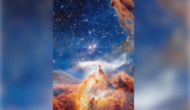 Glowing clouds of orange and blue dust swirl around three bright stars