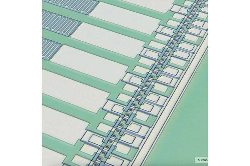 A travelling-wave parametric amplifier and converter for low-noise qubit readout