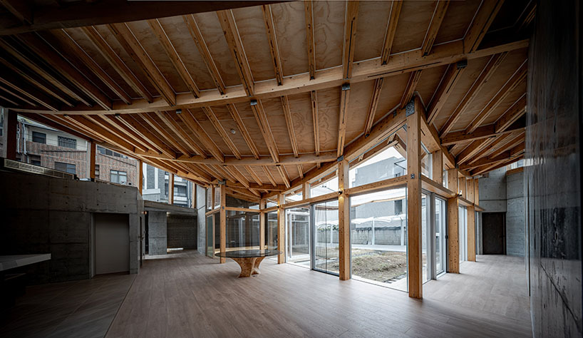 hyperbolic roof composed of curved timber slats tops concrete residence in taiwan